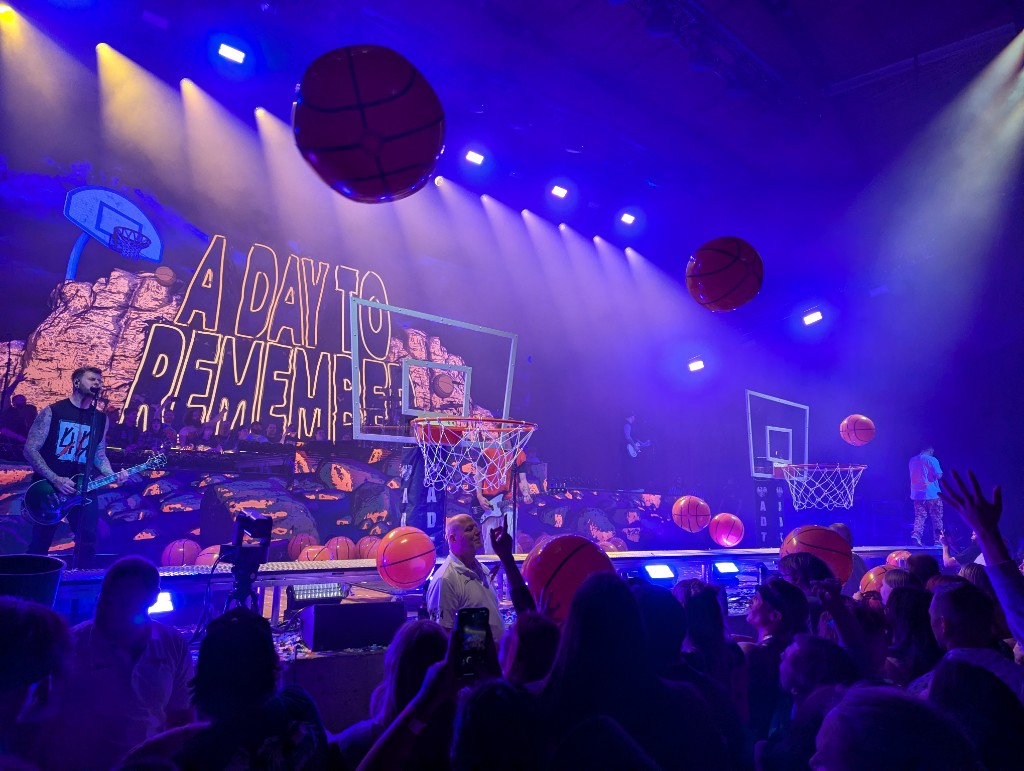 A Day To Remember concert stage with inflatable basketballs and basketball hoops